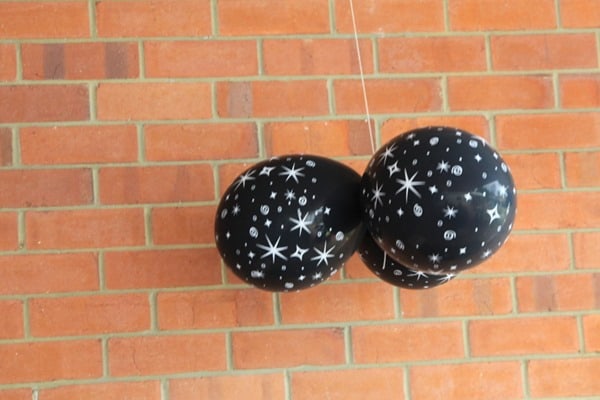Black balloons with stars